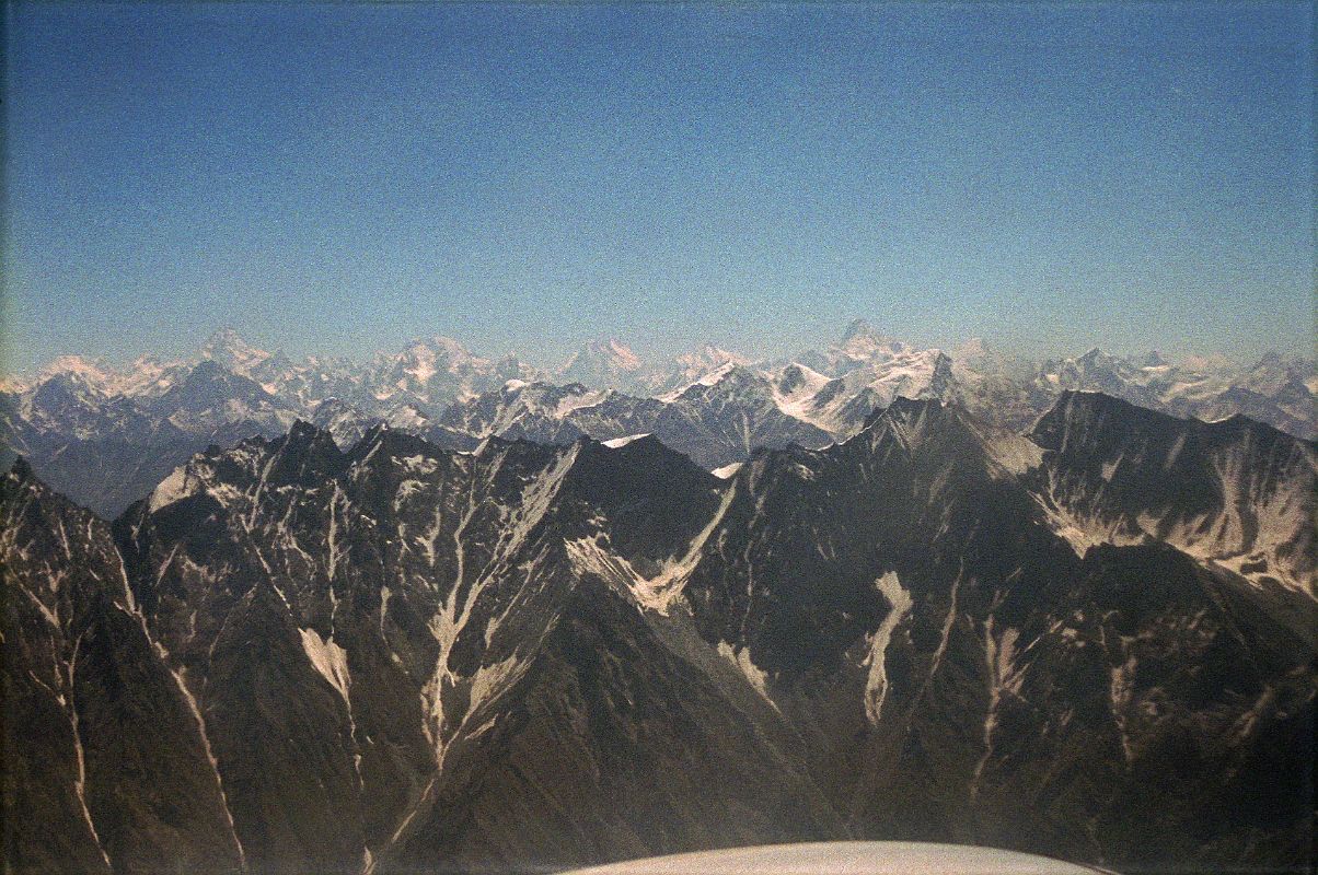 12 K2, Broad Peak, Gasherbrum IV, Gasherbrum I, Masherbrum On Flight From Islamabad To Skardu I can see a very large mountain in the hazy distance poking above the intervening mountains  K2! To the right of K2 is Broad Peak, the Gasherbrums, and to the right Masherbrum.